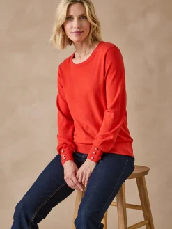 Pull boutons-bijoux aux manches