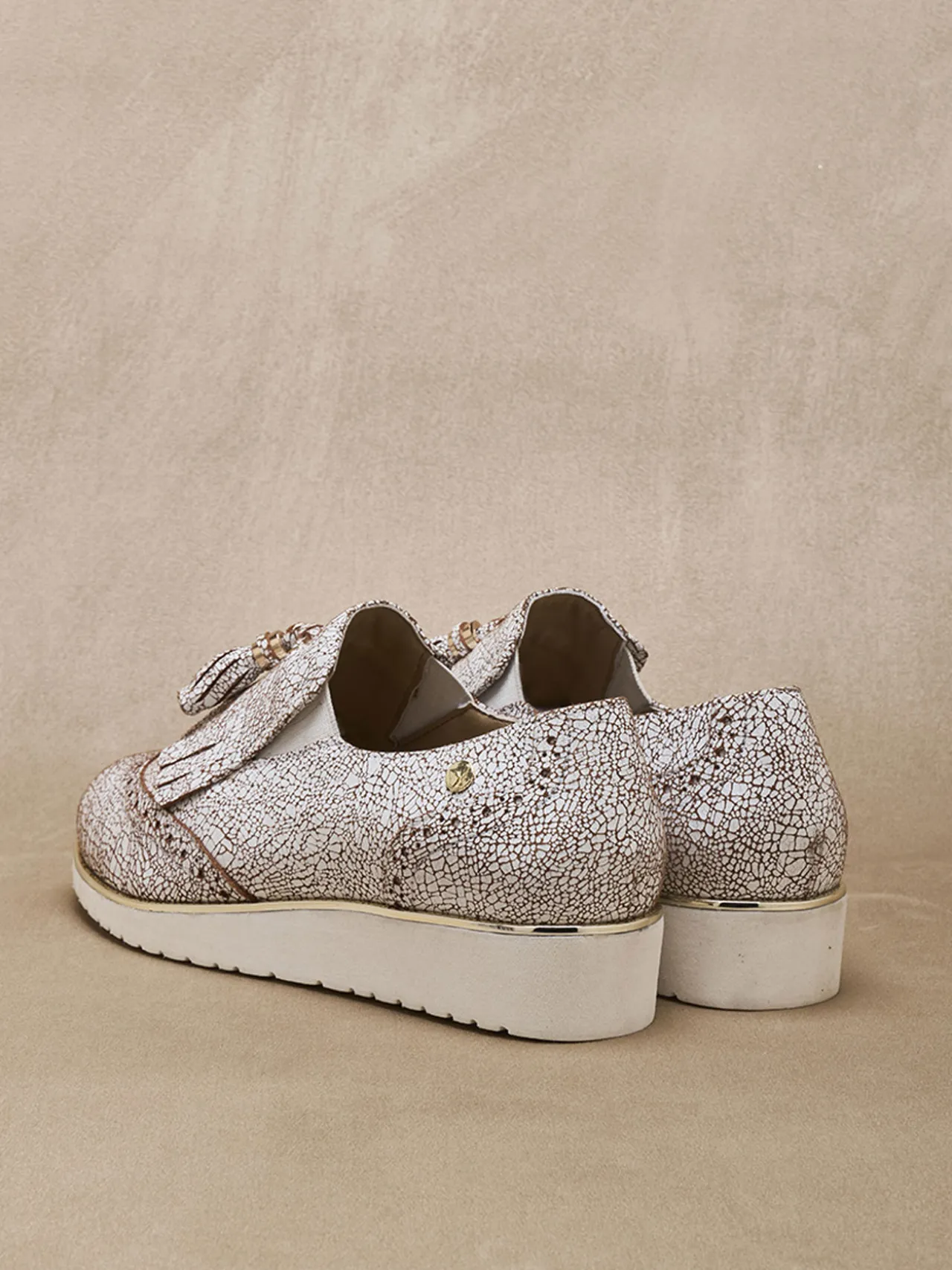 Sans-gêne à pompons élastiqués côtés